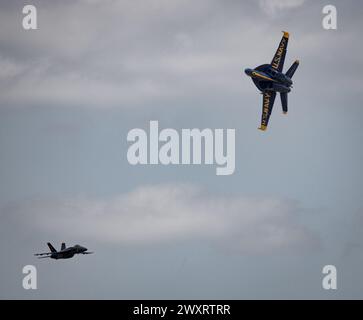 The United States Navy Blue Angel jets perform during a demonstration while flying in formation Stock Photo