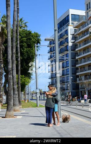 A couple with their pet dog in Jaffa, Israel. Stock Photo