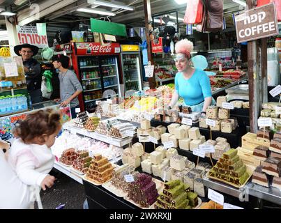A confectionery vendor selling Halva, Turkish Delight and other sweets at the Carmel market in Tel-Aviv, Israel. Stock Photo