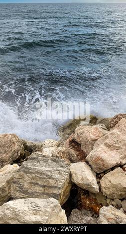 Waves crashing against the rocks of the coast of Malaga Stock Photo
