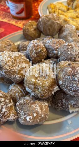 Famous Canarian dish , papas arrugadas and mojo picon on the table of a family home Stock Photo