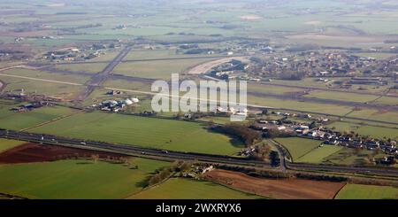 aerial view of RAF Leeming looking east across the A1(M) with the village of Londonderry in the immediate foreground Stock Photo