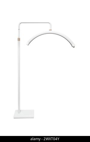 Modern LED floor lamp in the shape of a crescent. Lamp for minimalist interiors. Isolate on a white background. Stock Photo