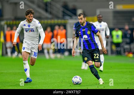 Milano, Italy. 01st Apr, 2024. Henrikh Mkhitaryan (22) of Inter and Bartosz Bereszynski (19) of Empoli seen in the Serie A match between Inter and Empoli at Giuseppe Meazza in Milano. (Photo Credit: Gonzales Photo/Alamy Live News Stock Photo