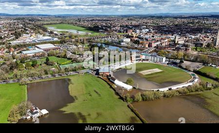 A general view of New Road, home of Worcestershire County Cricket club, partially flooded ahead of the new cricket season which starts on Friday April 5th. Also visible is Worcester Racecourse in the distance. Picture date: Tuesday April 2, 2024. Stock Photo