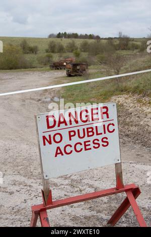 Danger - No public access sign and rusty tanks. Lost village of Imber. Stock Photo