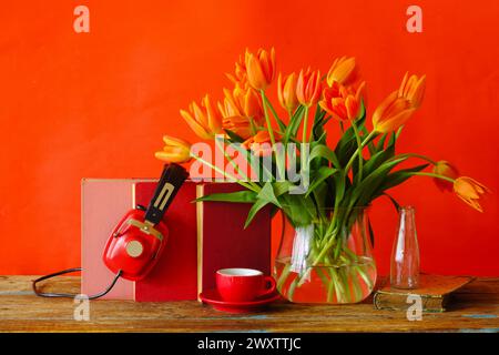 New book and audio book releases for spring and summer, with books,vintage headphone,tulip flowers and cup of coffee,Spring Book fair, inspiration,rea Stock Photo
