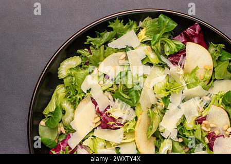 Macro food photography of salad; lettuce; apple, leaf; parmesan cheese, pine nuts; brunch; breakfast; background; raw; Stock Photo