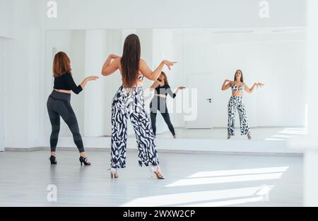 Beautiful woman with very big boobs dancing during the Desfile de
