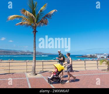 Gran Canaria, Canary Islands, Spain, 2nd April 2024. Tourists, many British, enjoying glorious sunshine on the city beach in Las Palmas on Gran Canaria. National Geographic has named Las Palmas, Gran Canaria, as the second best city to live in Spain. Bilbao topped the list with Barcelona and Madrid at the bottom of a top ten list. Credit: Alan Dawson/Alamy Live News. Stock Photo