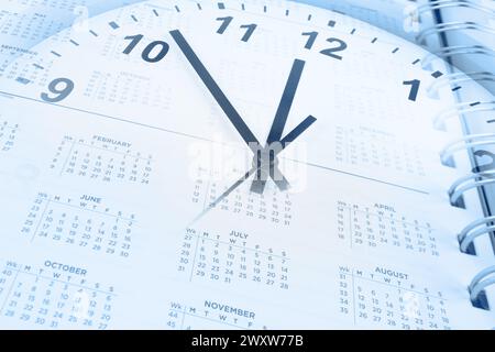 Clock face and calendar page. Time management Stock Photo