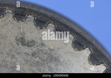 Close-up of a timing belt perfectly positioned on a timing belt pulley for smooth power transmission in machines. Stock Photo