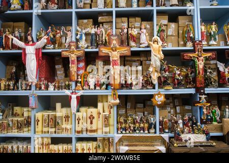 Christian figures, candles, saints in a store near Santee Alley. downtown Los Angeles, California, United States of America Stock Photo