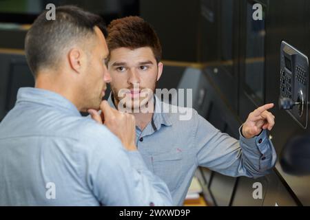 workers and cyber security network concept Stock Photo
