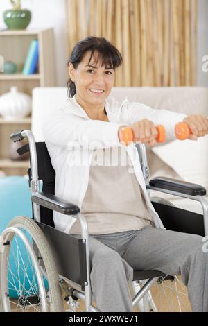 senior mature man doing exercises with dumbbells Stock Photo