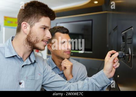 two technicians working in a workshop Stock Photo