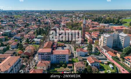 Limbiate aerial view, the parish of St. George, the church, homes and streets downtown. Monza and Brianza. 02-04-2024. Italy Stock Photo