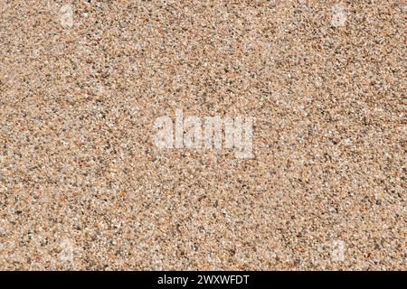 Fine river sand from gravel pit pile closeup as beige sand natural background Stock Photo
