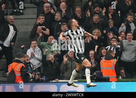 Newcastle United's Dan Burn celebrates scoring their side's second goal of the game during the Premier League match at St. James' Park, Newcastle upon Tyne. Picture date: Tuesday April 2, 2024. Stock Photo