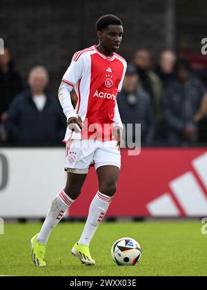 AMSTERDAM - Jinairo Johnson of Ajax U17 during the Ajax Future Cup 2024 match between Ajax o17 and FK Partizan o17 at De Toekomst sports complex on April 1, 2024 in Amsterdam, Netherlands. ANP | Hollandse Hoogte | GERRIT VAN COLOGNE Stock Photo