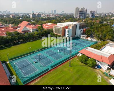 Bangkok, Thailand - December 15, 2023: Aerial view of International School Bangkok tennis court located in Bangkok, Thailand. Stock Photo