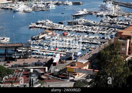 Monte Carlo, Tightly packed marina with boats and watercraft in front of a town, Principality of Monaco, Cote d'Azur Stock Photo