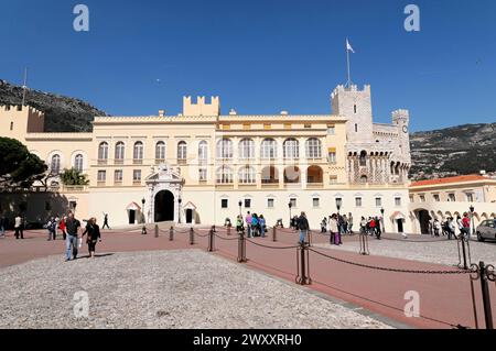 Changing of the guard at 12 o'clock in front of the Prince's Palace, Principality of Monaco, Traditional castle architecture with people in front of Stock Photo