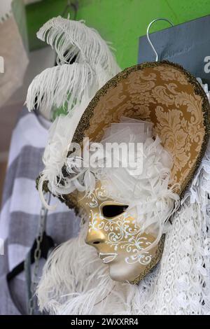Venetian carnival mask in a shop window, Burano, Veneto, Italy Stock Photo
