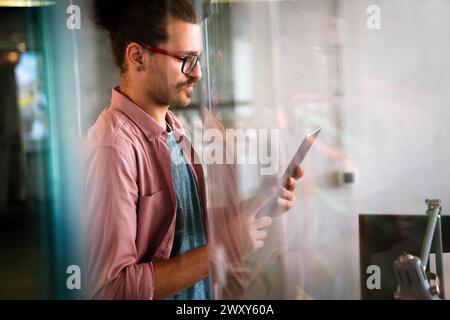 Success business man with tablet, analytics and developer for startup business website IT software Stock Photo