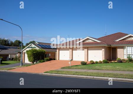 Glenwood, suburb of Sydney in the city of Blacktown, brick built detached house home with front garden and triple garages, Sydney,NSW,Australia Stock Photo