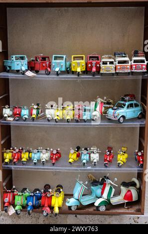 San Gimignano, Italy - Sept 17, 2022: Miniatures of Italian automotive icons on a store window in San Gimignano. Italy Stock Photo