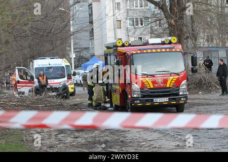 Non Exclusive: DNIPRO, UKRAINE - APRIL 02, 2024 - Specialized equipment is seen outside the building of an educational institution damaged by a Russia Stock Photo