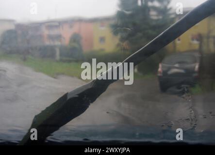 rainy drive in town with wiper on Stock Photo