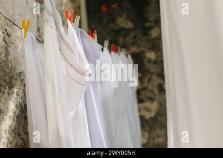 Freshly washed laundry hanging on the street in Dubrovnik old town, Croatia. Selective focus. Stock Photo