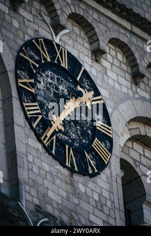 Clock tower on side of urban building Stock Photo