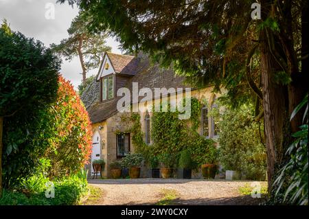 The Old School House (1848) now converted to a private home in Nutbourne village near Pulborough in West Sussex, England on a sunny, early spring day. Stock Photo