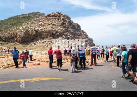 tourists or people at Cape Point or Cape of Good Hope nature reserve queue to have their photo taken at south west tip of Africa concept travel Stock Photo