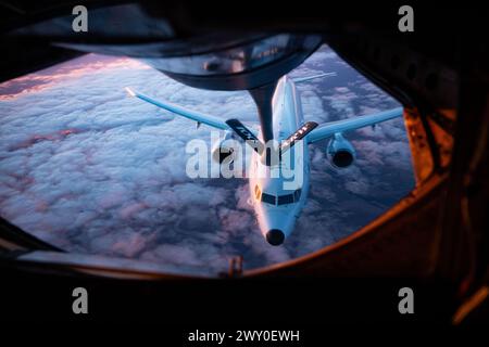 A U.S. Navy P-8 Poseidon approaches a KC-135 Stratotanker from the 100th Air Refueling Wing, Royal Air Force Mildenhall, England, for aerial refueling Stock Photo
