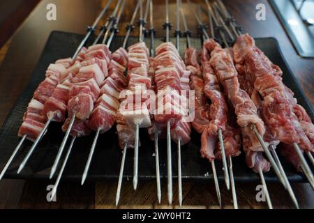 Fresh raw lamb skewers in restaurant Stock Photo