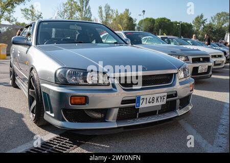 Front view of a tenth generation Nissan Skyline GT-R34 with a changing ...