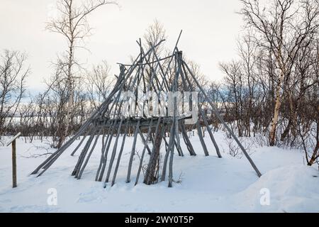 Skeleton of a Saami tent in a wintry landscape in Abisko National Park, northern Sweden. Stock Photo