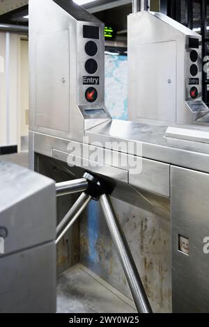 Turnstile barrier entry to public mass transit commuter subway train in New York City Stock Photo