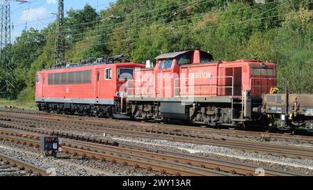 Class 155 heavy electric powered heavy freight locomotive with class 294 Railion diesel shunter and goods wagons at Cologne-Gremberg, Germany, Europe. Stock Photo