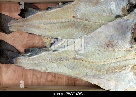 Crate with dried salted cod Stock Photo