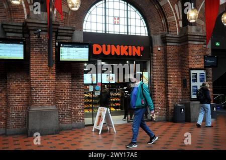 Copenhagen/ Denmark/03 April 2024/Shoppers and people walk by and buy at dunkin cafe inCopenhagen. Photo.Francis Joseph Dean/Dean Pictures Stock Photo