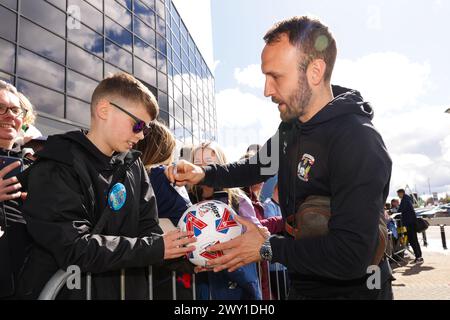 Coventry City's Liam Kelly signs autographs for fans ahead of the Sky Bet Championship match at the Coventry Building Society Arena, Coventry. Picture date: Monday April 1, 2024. Stock Photo
