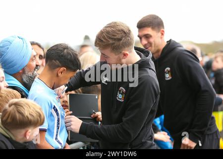Coventry City's Josh Eccles signs autographs before the Sky Bet Championship match at the Coventry Building Society Arena, Coventry. Picture date: Monday April 1, 2024. Stock Photo
