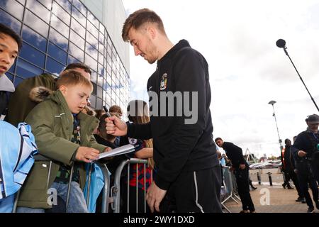 Coventry City's Josh Eccles signs autographs for fans before the Sky Bet Championship match at the Coventry Building Society Arena, Coventry. Picture date: Monday April 1, 2024. Stock Photo
