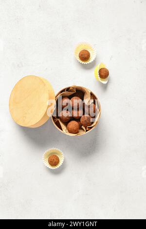 Box with tasty chocolate truffles on white background Stock Photo