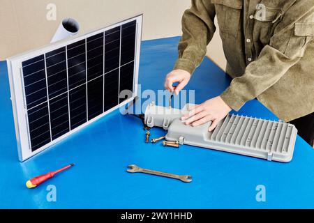 Fully autonomous, stand alone solar powered light, installation on mounting bracket before fixing to pole or wall. Stock Photo